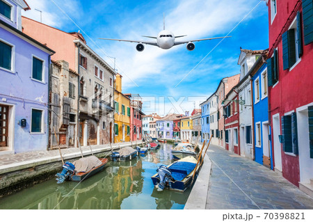 Front of real plane aircraft, on Burano Colorful house in Venice, Italy background 70398821