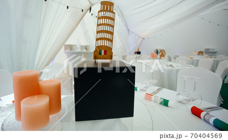 Served table with Italy topic decorated by flags and leaning tower of pisa Served table with Italy topic decorated by flags and leaning tower of pisa 70404569