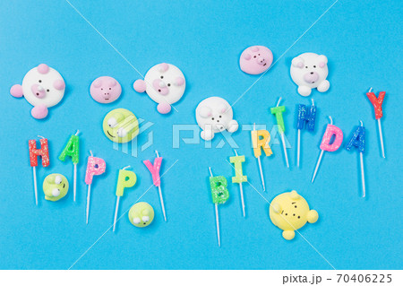 multicolored marshmallows in the form of little animals scattered on a blue background, an inscription birthday from candles, a merry holiday multicolored marshmallows in the form of little animals scattered on a blue background, an inscription birthday from candles, a merry holiday 70406225