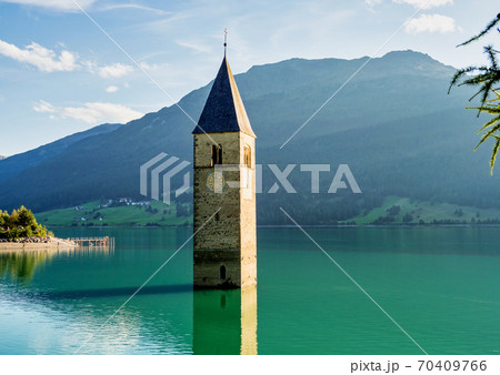 Church in the water at Lake Reschen in Tyrol in north Italy 70409766