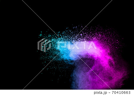Explosion of blue pink colored powder isolated on black background.Pink blue dust splash. Explosion of blue pink colored powder isolated on black background.Pink blue dust splash. 70410663