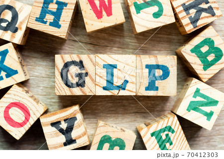 Alphabet letter block in word GLP (Abbreviation of Good laboratory practice) with another on wood background Alphabet letter block in word GLP (Abbreviation of Good laboratory practice) with another on wood background 70412303