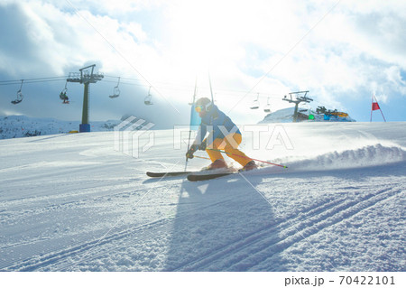 Slalom Skier attacks a gate Slalom Skier attacks a gate 70422101