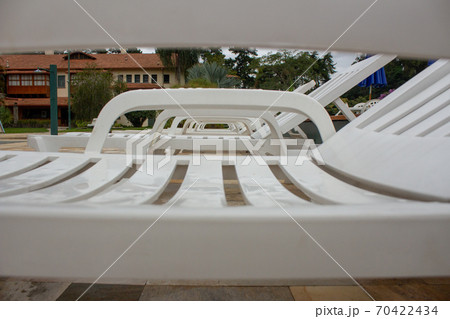 Pool chairs on a resort used for sunbath Pool chairs on a resort used for sunbath 70422434
