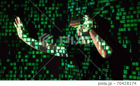 Double exposure of a caucasian man and Virtual reality headset is presumably a gamer or a hacker cracking the code into a secure network or server, with lines of code Double exposure of a caucasian man and Virtual reality headset is presumably a gamer or a hacker cracking the code into a secure network or server, with lines of code 70428174