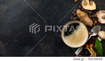 Mushroom Chaga Coffee Superfood Trend-dry and fresh mushrooms and coffee beans on dark background Mushroom Chaga Coffee Superfood Trend-dry and fresh mushrooms and coffee beans on dark background 70429949