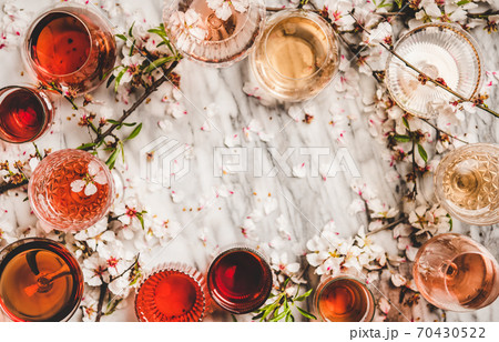 Shades of rose wine over marble background, copy 70430522