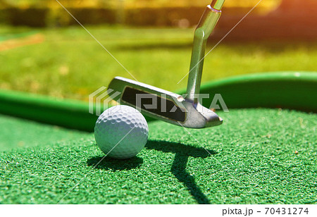 Golf ball and Golf Club on Artificial Grass Golf ball and Golf Club on Artificial Grass 70431274