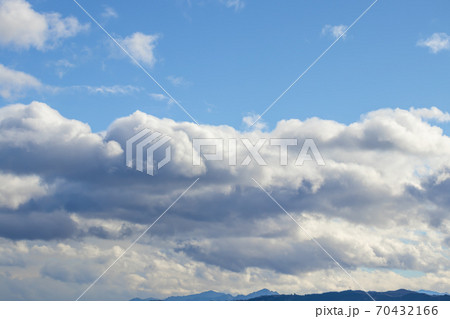 Mountain range in clear weather in contrasting rain clouds before the rain Mountain range in clear weather in contrasting rain clouds before the rain 70432166
