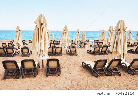 Scenic view of private sandy beach with sun beds from the sea and the mountains. Amara Dols Vita Luxury Hotel. Resort. Tekirova Kemer. Turkey. Scenic view of private sandy beach with sun beds from the sea and the mountains. Amara Dols Vita Luxury Hotel. Resort. Tekirova Kemer. Turkey. 70432214