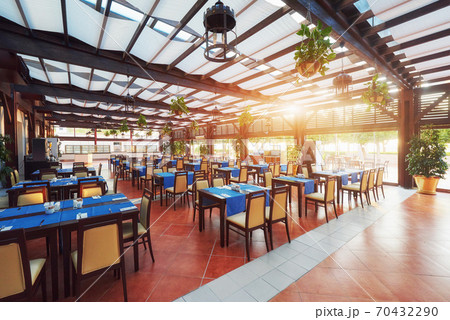 Empty served restaurant table waiting for visitors is located on the beach. Amara Dolce Vita Luxury Hotel. Resort. Tekirova-Kemer Empty served restaurant table waiting for visitors is located on the beach. Amara Dolce Vita Luxury Hotel. Resort. Tekirova-Kemer 70432290