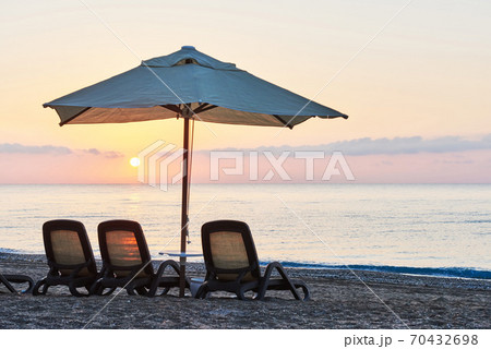 Scenic view of private sandy beach on the beach with sun beds against the sea and mountains. Amara Dolce Vita Luxury Hotel. Resort. Tekirova-Kemer Scenic view of private sandy beach on the beach with sun beds against the sea and mountains. Amara Dolce Vita Luxury Hotel. Resort. Tekirova-Kemer 70432698