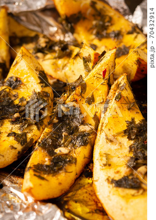 Baked pumpkin with dill and parsley, spices 70432914