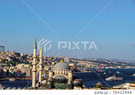 Mosque minarets and Bosphorus bridge in Istanbul in Turkey and the sea of Marmara on background Mosque minarets and Bosphorus bridge in Istanbul in Turkey and the sea of Marmara on background 70432948