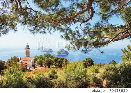 Lighthouse Gelidonya Peninsula in spring. Beautiful landscapes outdoors in Turkey and Asia. The landscape in the Mediterranean. Lighthouse Gelidonya Peninsula in spring. Beautiful landscapes outdoors in Turkey and Asia. The landscape in the Mediterranean. 70433630