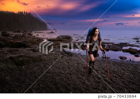 Adventurous girl hiking Juan de Fuca Trail 70433694