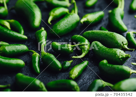 Jalapeno Peppers on Concrete Background Jalapeno Peppers on Concrete Background 70435542