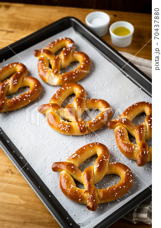 baked pretzel on cooking pan baked pretzel on cooking pan 70437880