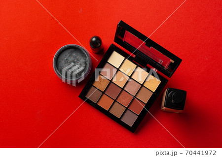 Set of cosmetics isolated over red background. 70441972