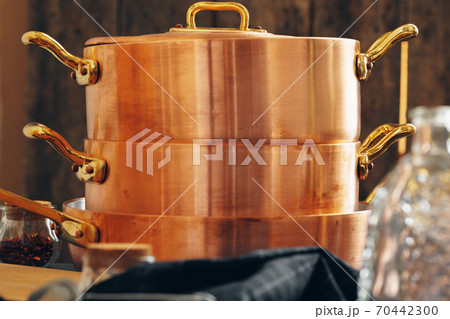 New copper cookware for professional kitchen close up New copper cookware for professional kitchen close up 70442300