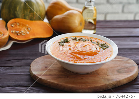Close up photo of pureed pumpkin soup with pumpkin seeds 70442757