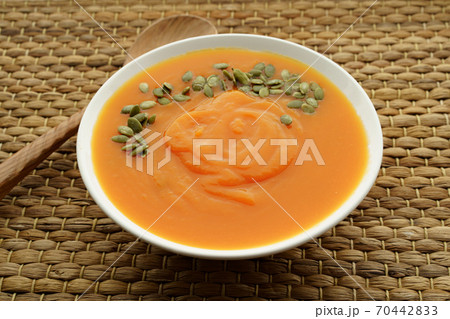Close up photo of pureed pumpkin soup with pumpkin seeds 70442833