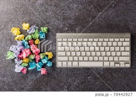 crumpled paper stick note ball with computer keyboard crumpled paper stick note ball with computer keyboard 70442927
