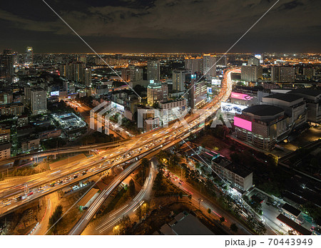 Aerial view of busy cars with traffic jam in the rush hour on highway road street on bridge in Bangkok Downtown, urban city in Asia, Thailand at night. Intersection junction. Toll gate in Rama 9 70443949