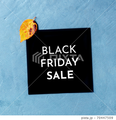 Black Friday Sale card with an autumn leaf, shot from the top 70447509