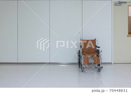 Empty wheelchair to patient or disabled parked in empty room at hospital. 70448631