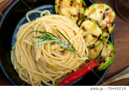 italian spaghetti pasta with zucchini sauce on iron skillet italian spaghetti pasta with zucchini sauce on iron skillet 70449219