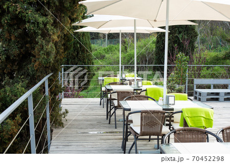 Chairs with a table in an outdoor cafe overlooking the city Chairs with a table in an outdoor cafe overlooking the city 70452298