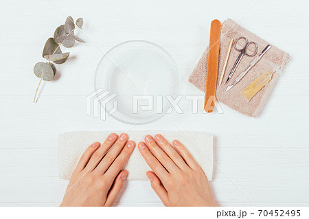 Female hands next to set of tools and beauty products Female hands next to set of tools and beauty products 70452495