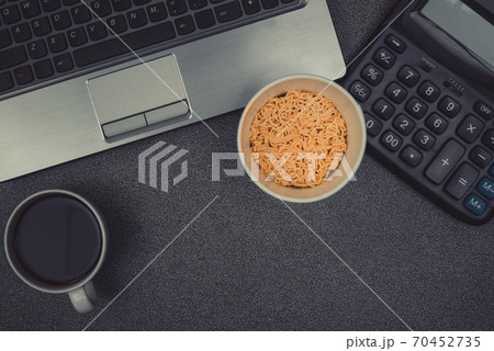 Laptop computer or notebook, calculator and cup of coffee on working table with copy space top view. Laptop computer or notebook, calculator and cup of coffee on working table with copy space top view. 70452735