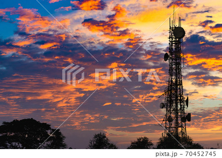 Silhouette of the Antenna of cellular cell phone and communication system tower on cloud and blue sky background, Telecommunication technology concept. Silhouette of the Antenna of cellular cell phone and communication system tower on cloud and blue sky background, Telecommunication technology concept. 70452745