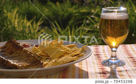 BBQ ribs, chips and beer 70453206