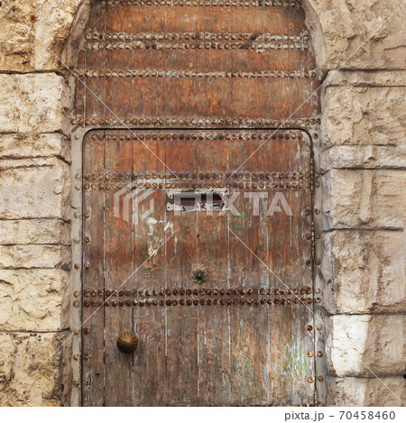Texture of old wood, texture of a wooden door with a natural pattern. background. Texture of old wood, texture of a wooden door with a natural pattern. background. 70458460