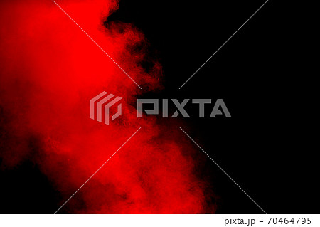 Red powder explosion on black background. Freeze motion of red dust particles splash. Red powder explosion on black background. Freeze motion of red dust particles splash. 70464795