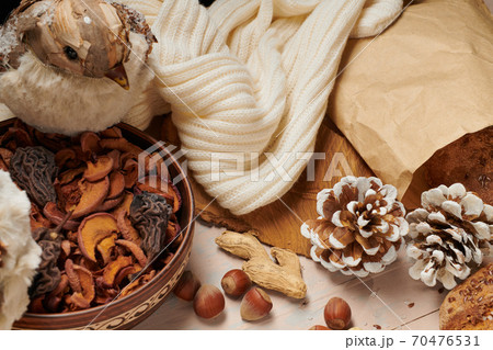 christmas decoration in rustic style and holiday background, still life on wooden backdrop, a stuffed bird and other christmas decoration in rustic style and holiday background, still life on wooden backdrop, a stuffed bird and other 70476531