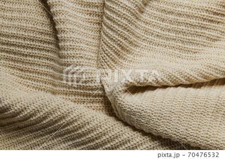 wool knitted fabric as background, beige color wool knitted fabric as background, beige color 70476532