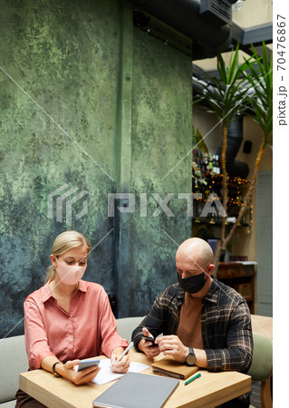 People using gadgets in cafe People using gadgets in cafe 70476867