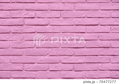 ピンクカラーのペイントレンガの壁の写真素材