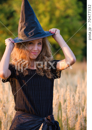 Young witch in a hat Young witch in a hat 70477332