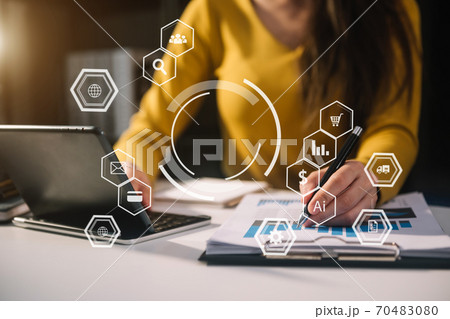 Businesswoman hand working digital marketing media in virtual screen with mobile phone and modern compute with VR icon diagram at office in morning light Businesswoman hand working digital marketing media in virtual screen with mobile phone and modern compute with VR icon diagram at office in morning light 70483080