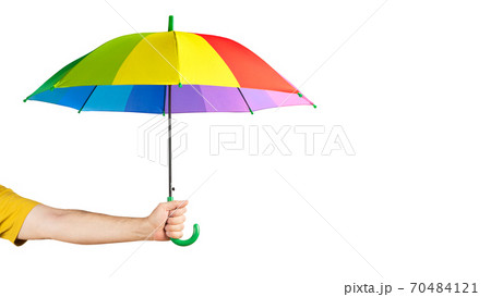 Hand holding Multicolored umbrella isolated on a white. Hand holding Multicolored umbrella isolated on a white. 70484121