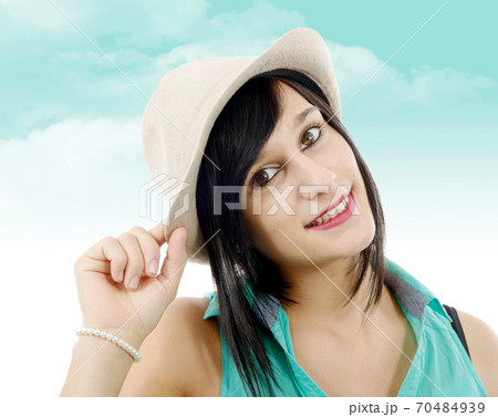 pretty brunette girl with a summer hat pretty brunette girl with a summer hat 70484939