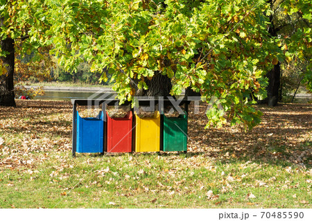 old Colorful Recycle Bins In The Park. urns for separate collection of garbage. old Colorful Recycle Bins In The Park. urns for separate collection of garbage. 70485590