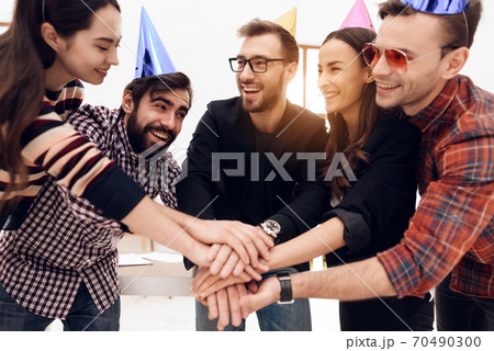 People stand in circle and lay hands on each other People stand in circle and lay hands on each other 70490300