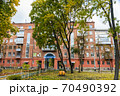 In the courtyard of stalinka building. Orange and green trees, Ukraine, Kharkov 70490392