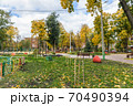 In the courtyard of stalinka building. Orange and green trees, Ukraine, Kharkov 70490394
